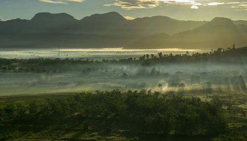 Scenic view of mountains against sky during sunset