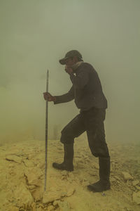 Manual worker on construction site in dusty environment