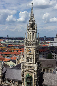 View of buildings against cloudy sky