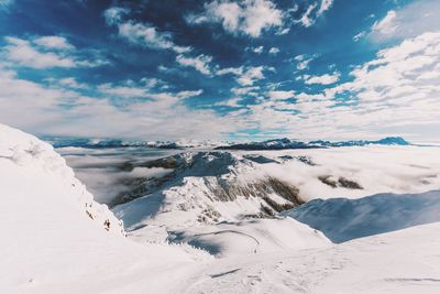 Scenic view of landscape against sky during winter