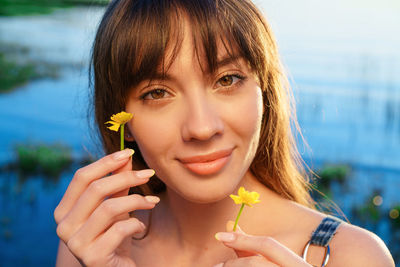 Close-up portrait of a smiling young woman