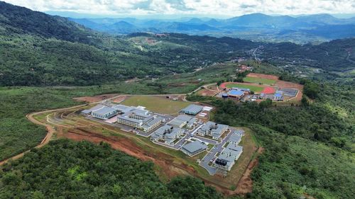 High angle view of trees and mountains against sky