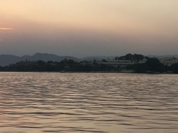 Scenic view of sea against sky at sunset