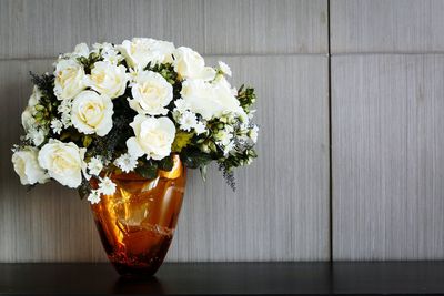 Close-up of white rose on table