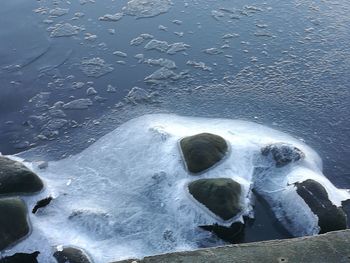 Close-up of waves in sea against sky