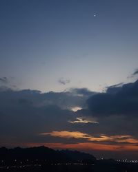 Scenic view of silhouette against sky at sunset