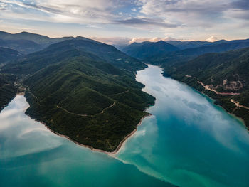 Aerial view of sea against cloudy sky