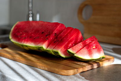 Close-up of strawberry slices on cutting board