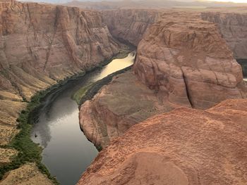 Scenic view of rock formation by river