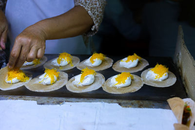 High angle view of man preparing food