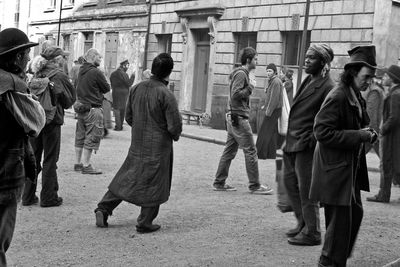 Group of people walking in front of building