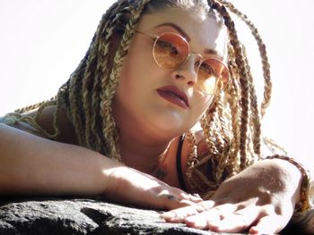 Close-up portrait of woman with braided hair