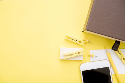 Close-up of yellow paper over white background