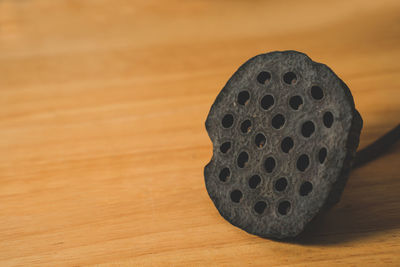 Close-up of hole on table