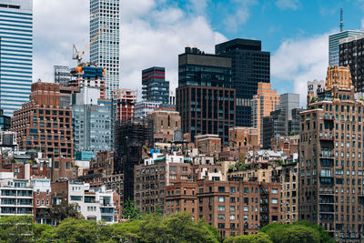 Buildings in city against sky