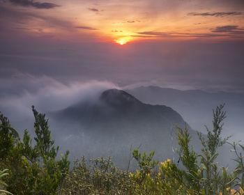 Scenic view of mountains against sky during sunset