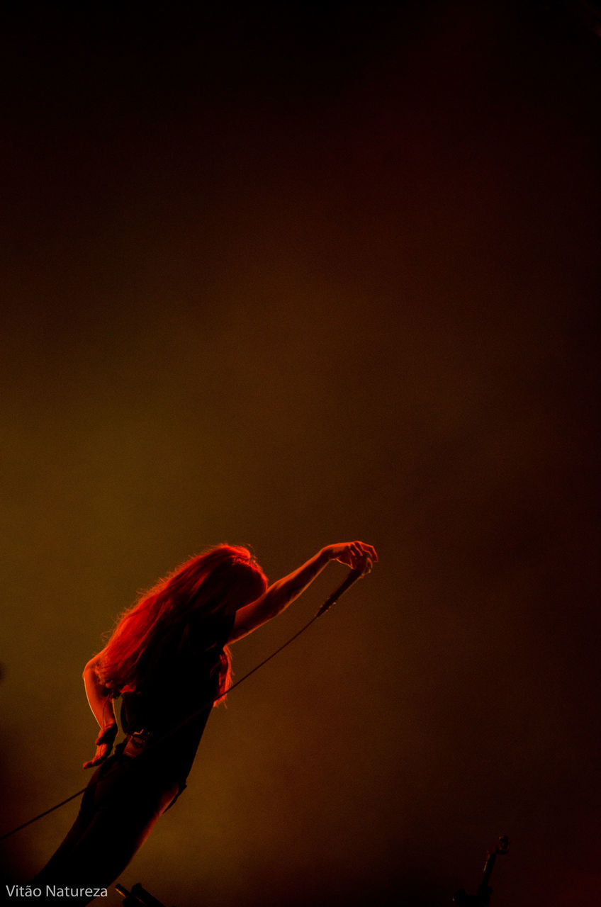 red, studio shot, one person, adults only, people, one woman only, only women, human body part, adult, indoors, close-up