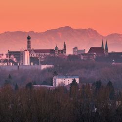 Buildings against sky during sunset