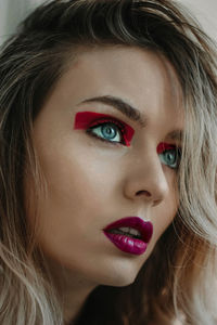 Close-up of young woman creative makeup 