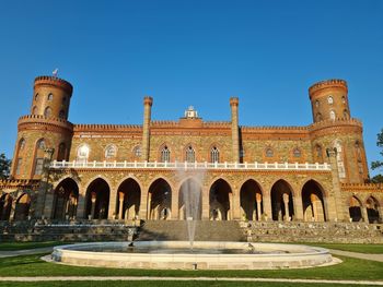 Facade of historic building against clear blue sky