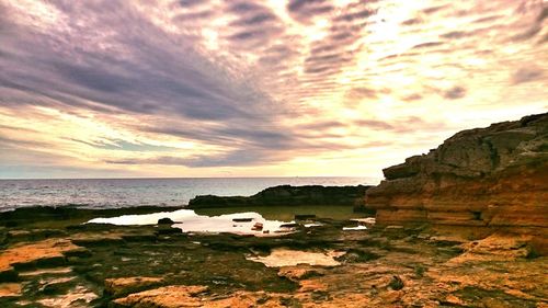 Scenic view of sea against dramatic sky