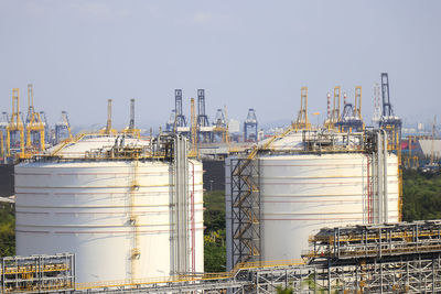 Stack of factory against clear sky