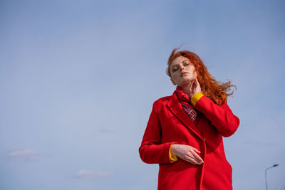 Portrait of a young woman in a red coat