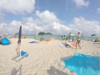 Scenic view of beach against blue sky