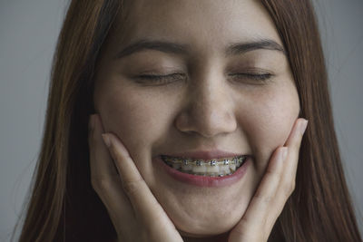 Close-up portrait of a smiling young woman