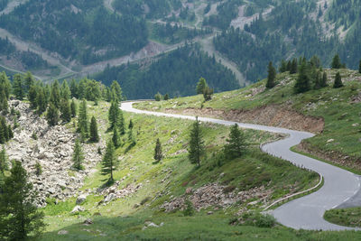 High angle view of road amidst trees and mountains