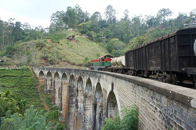 Train on railroad track against sky