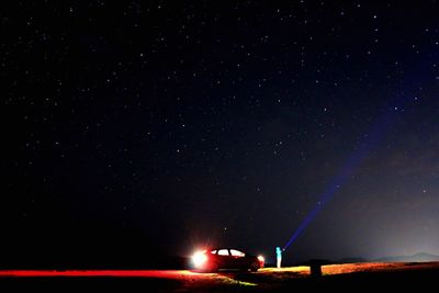 Light trails against sky at night