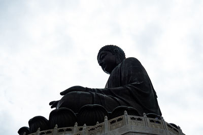 Low angle view of statue against sky