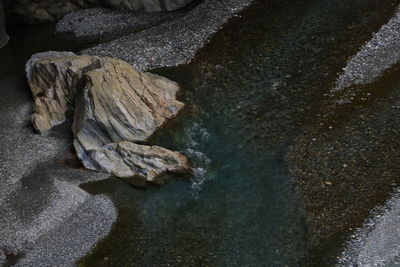 High angle view of rocks on shore