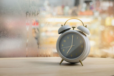 Close-up of clock on table
