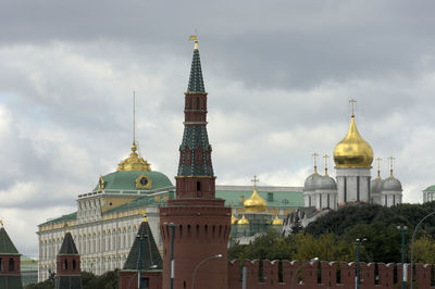 Low angle view of church against cloudy sky