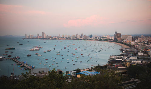 High angle view of bay and buildings against sky