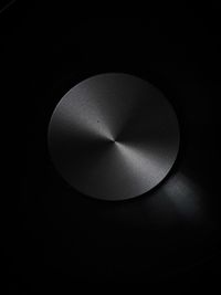 Close-up of electric lamp against black background
