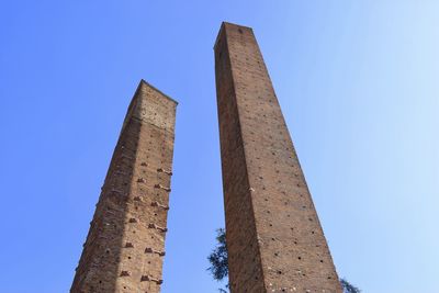 Low angle view of historical building against blue sky