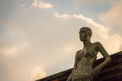 Low angle view of statue against sky