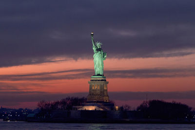 Statue of liberty against sky during sunset