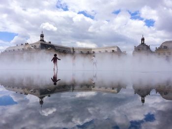 Full length of man in water against sky