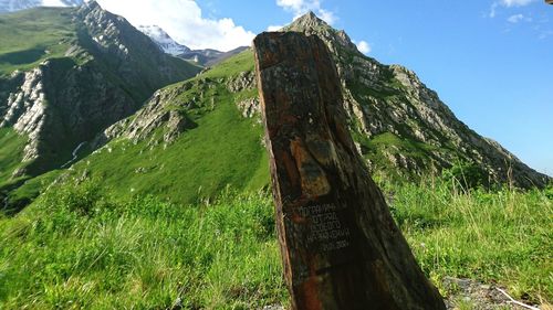 Scenic view of green mountains against sky