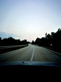 Road passing through car window