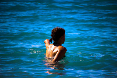 Woman swimming in pool