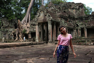 Full length of man standing outside temple