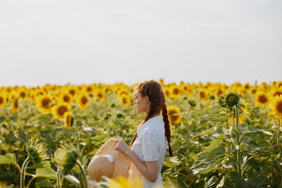 Portrait of young woman holding flowers