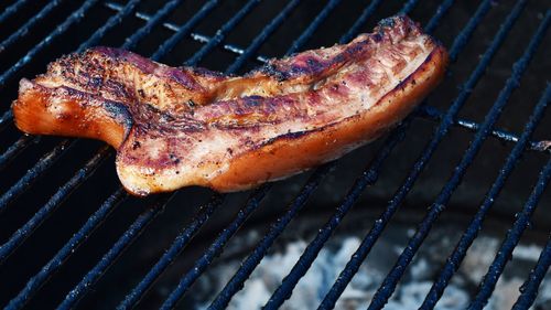 High angle view of meat on barbecue grill