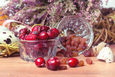 Close-up of strawberries in glass jar on table