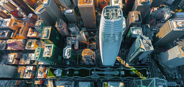 Aerial view of modern buildings in city against sky